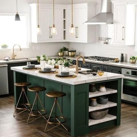 Green kitchen island with gold accents