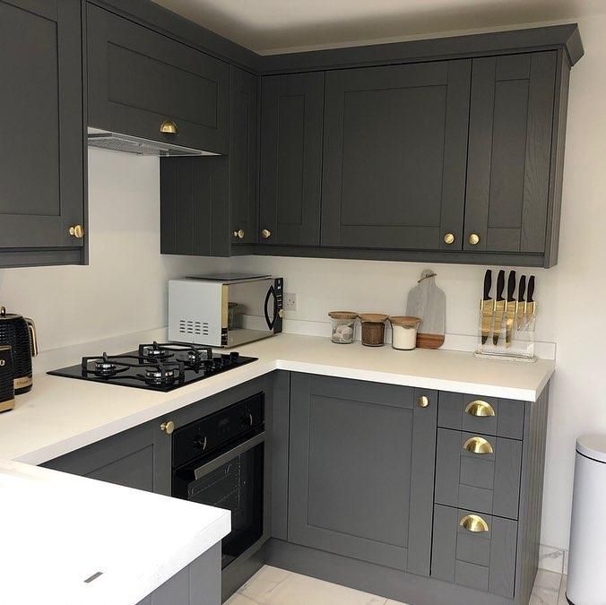 Grey shaker style kitchen with gold knobs