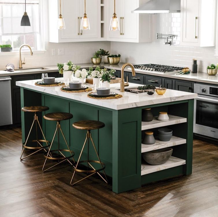 Stylish green kitchen with gold accents