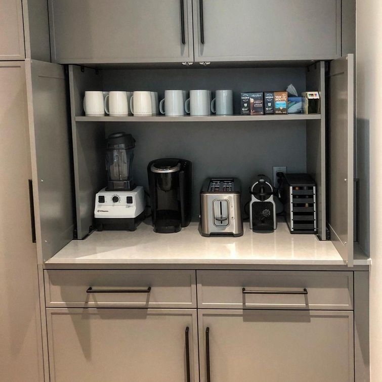 Organized small appliances in a cabinet