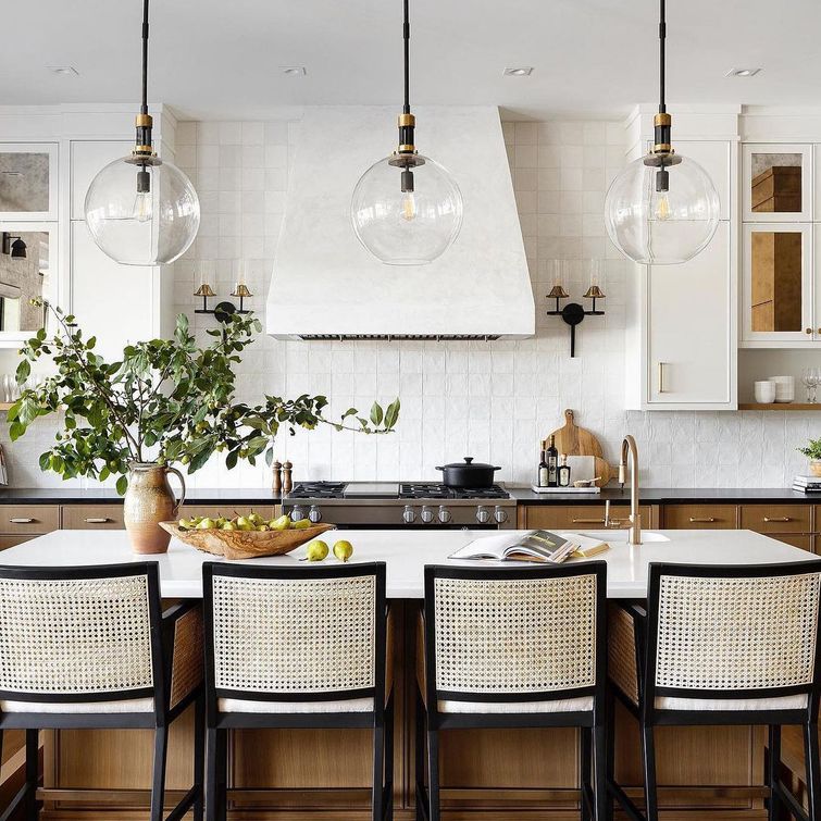 Glass pendant lights over kitchen island