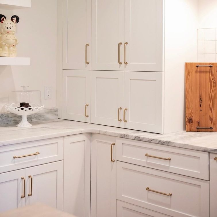 Golden appliance garage in a sleek kitchen
