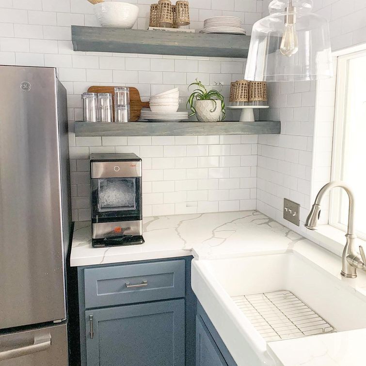 Open shelving kitchen with subway tile backsplash