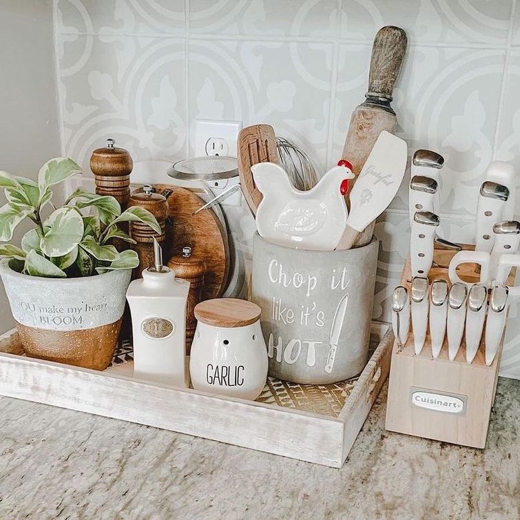 Wooden kitchen counter with white accents and a 15-piece cutlery set